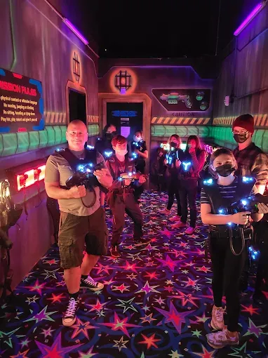 Group playing laser tag at SacTag two-story arena in Sacramento.
