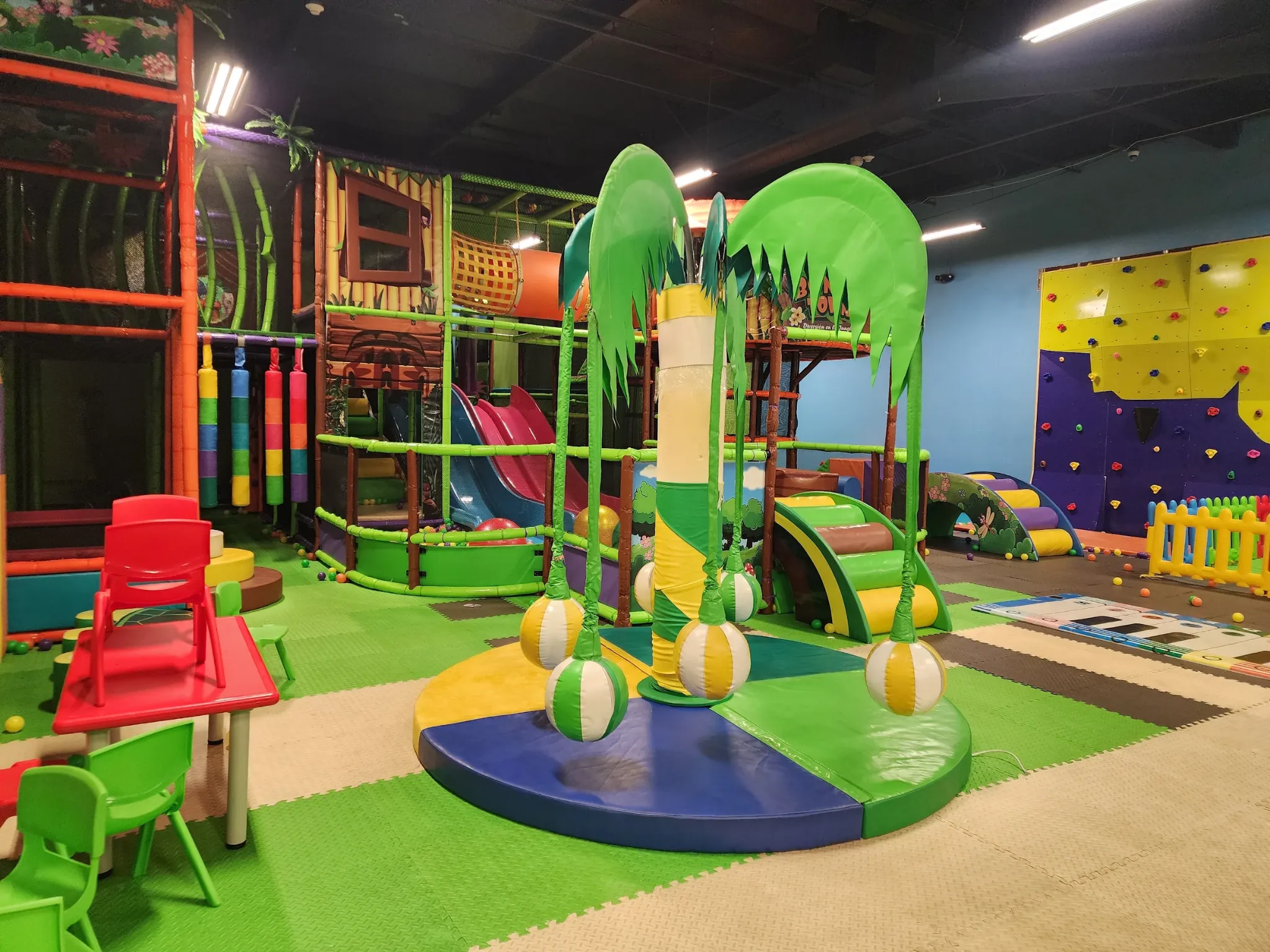 Colorful indoor children's soft play area with jungle theme at SacTag Sacramento.
