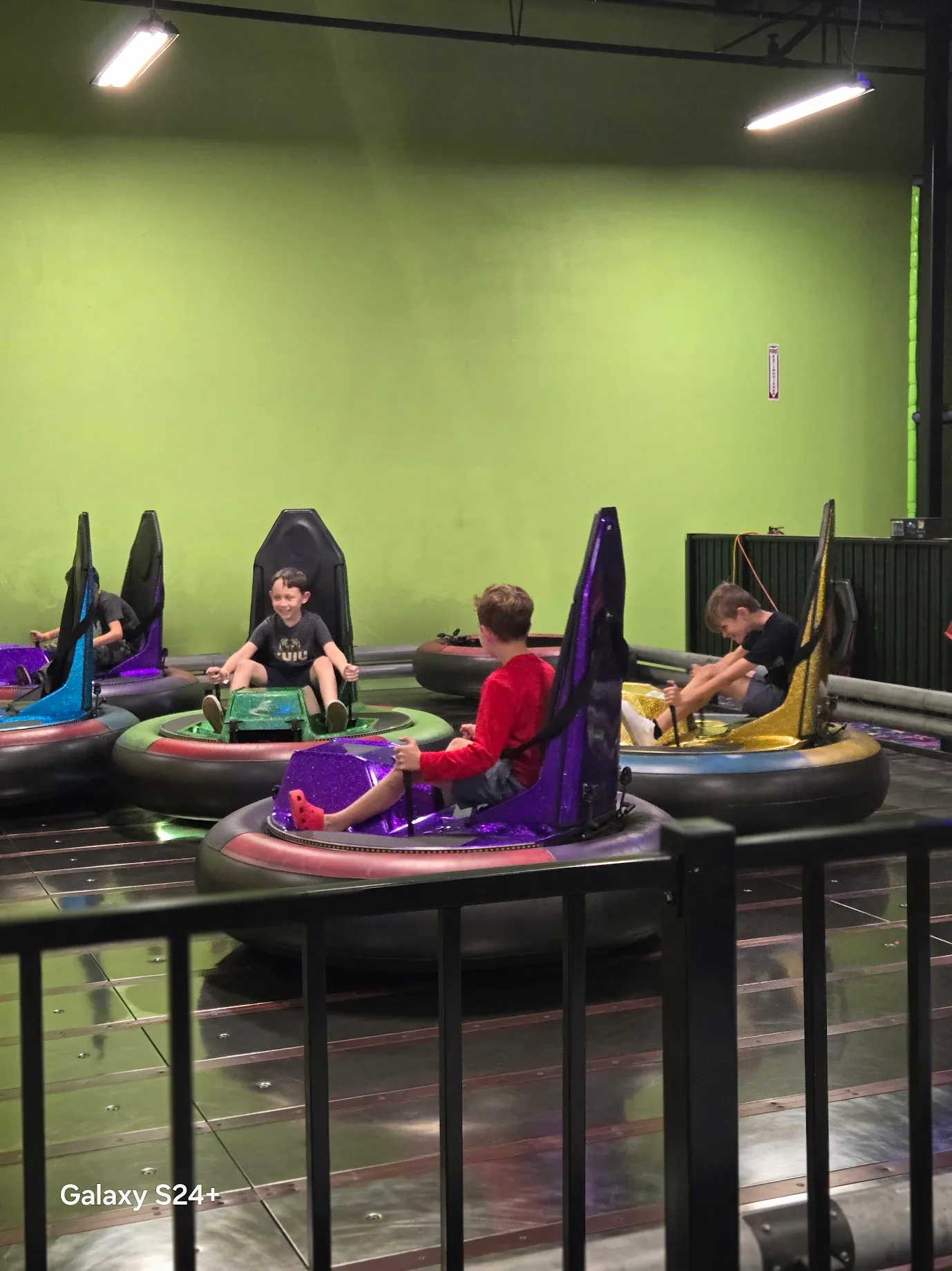 Kids on bumper cars at SacTag indoor entertainment center.
